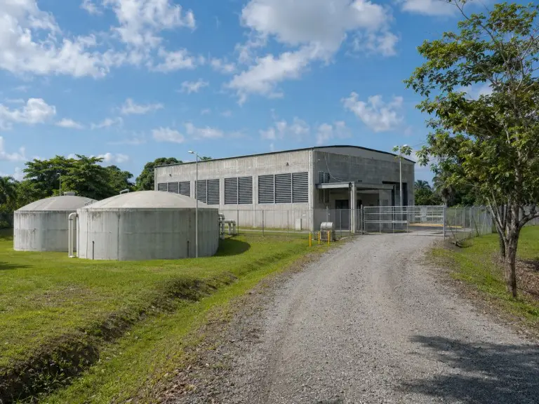 Municipal drinking water treatment plant with iron and manganese removal filtration building and clear-water reservoir