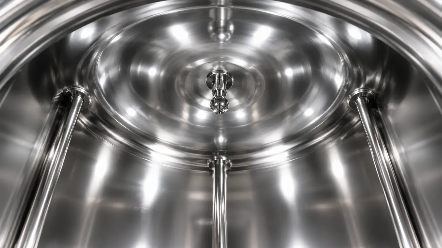 In-place cleaning spray ball inside SS316L pure water storage tank showing mirror-polished interior